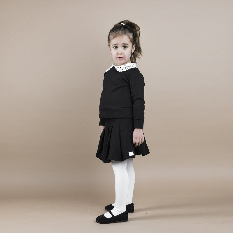 THE JERSEY PLEATED SKIRT - ALL BLACK - The Tiny Universe Skirts